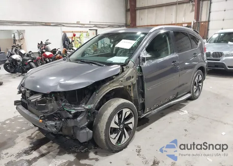 2016 Honda Cr-V Touring z USA, uszkodzony, nr VIN 5J6RM4H93GL125941